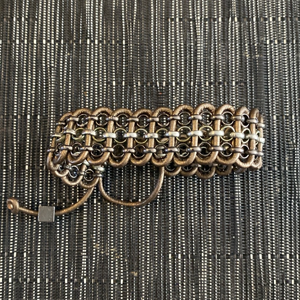 Hand made “copper coloured” leather and silver bracelet